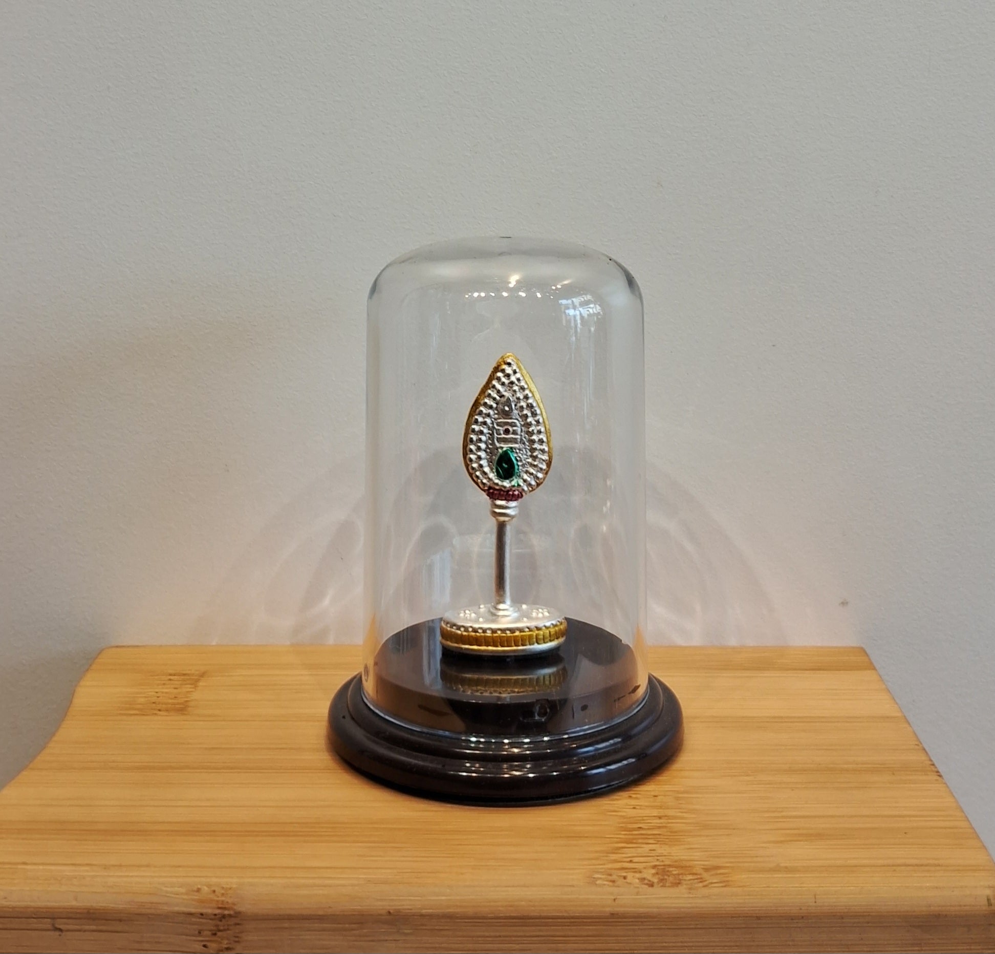 Silver Vel with green stone