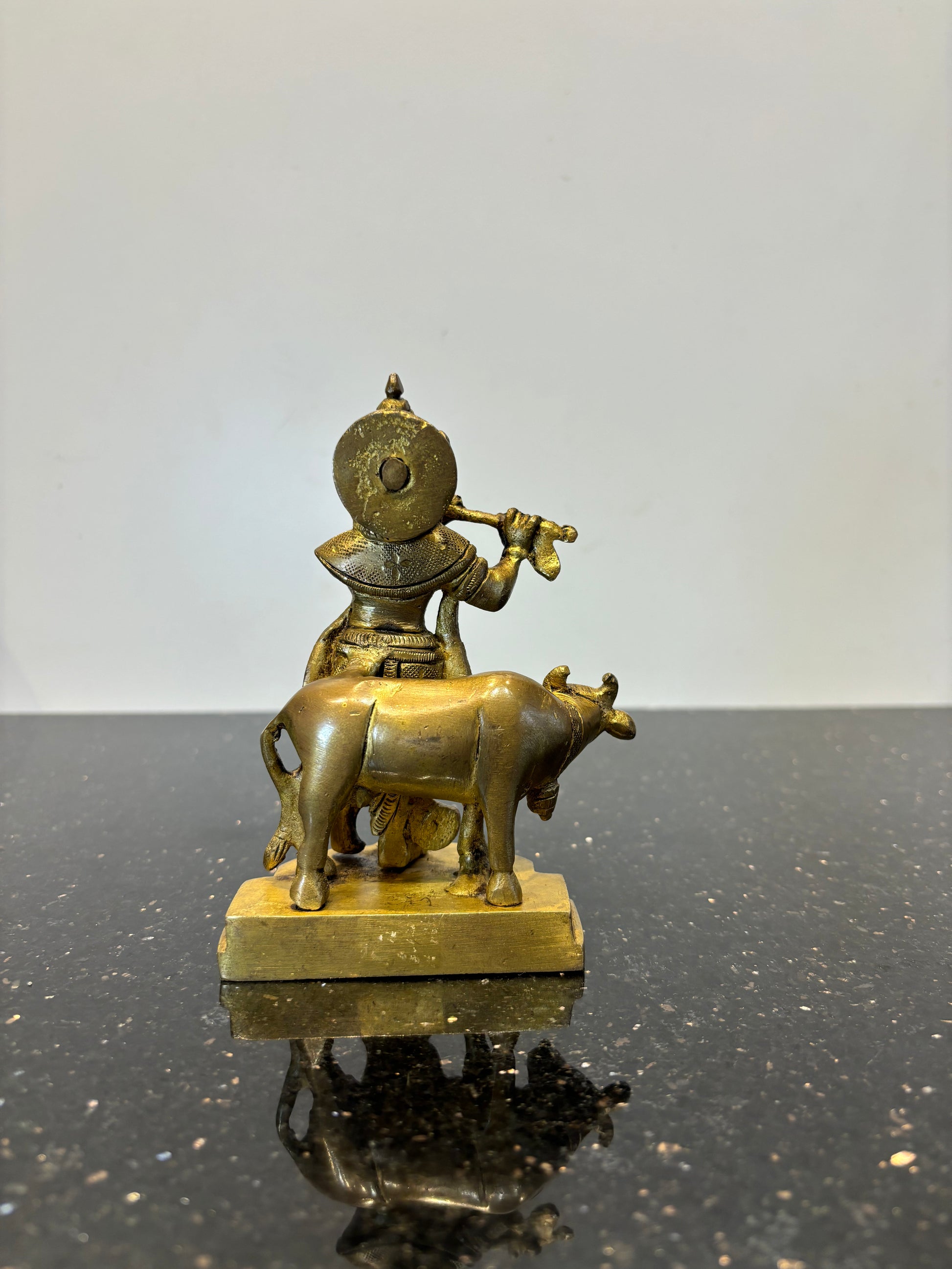 Krishna with flute cow