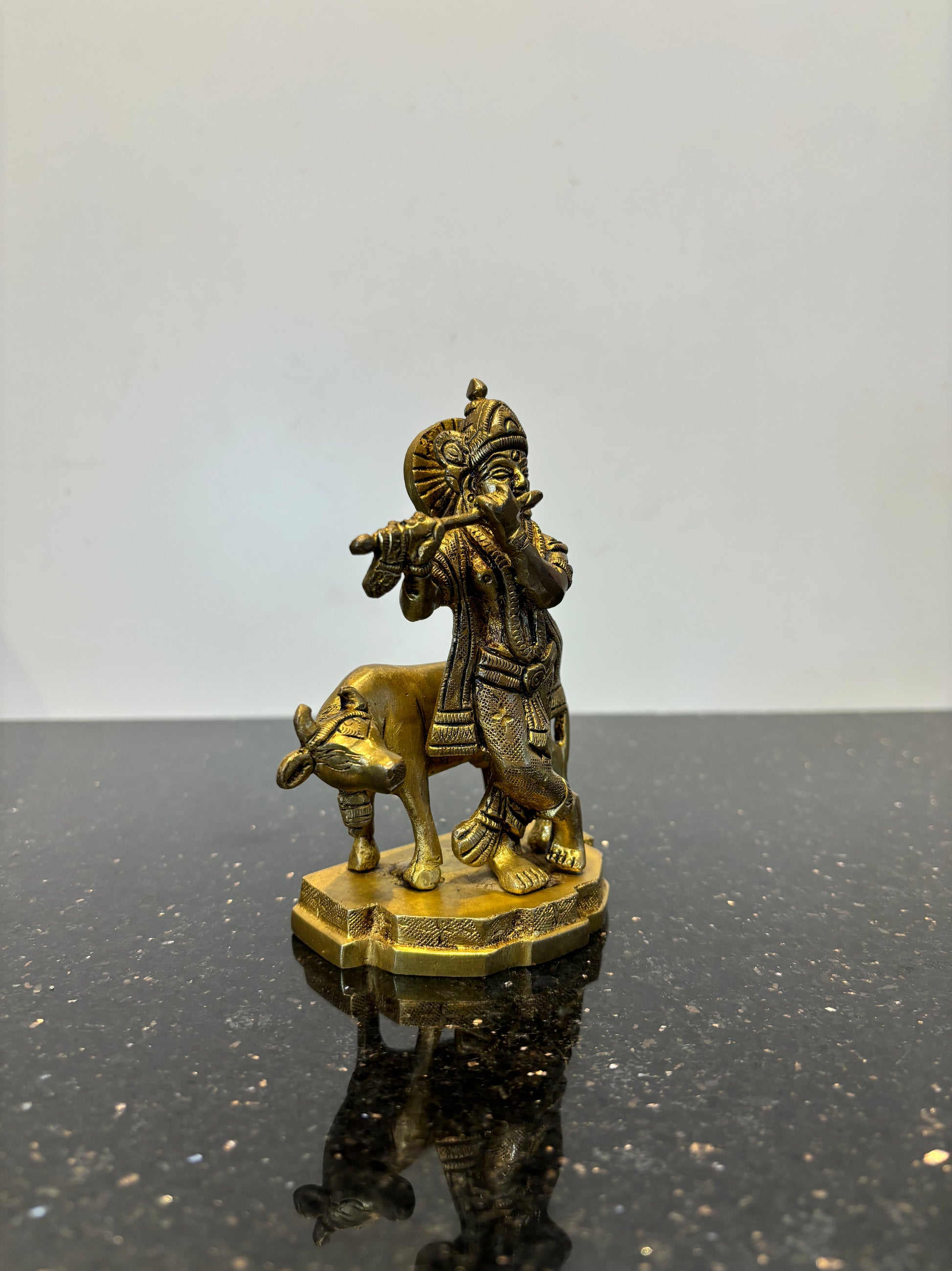 Krishna with flute cow